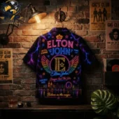 Elton John themed neon-inspired graphic button-up shirt hanging on a brick wall