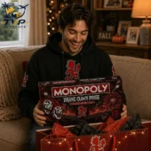 2026 Monopoly Insane Clown Posse Collector’s Edition Board Game 2 Man smiling while opening an Insane Clown Posse Monopoly Collector Edition board game.