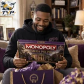 2026 Monopoly Omega Psi Phi Limited Collector Edition Board Game 2 Man smiling while holding Omega Psi Phi Monopoly board game