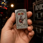 AC_DC 53rd Anniversary 2026 Special Edition Zippo Lighter 2 AC/DC 53rd Anniversary Zippo lighter held in hand