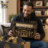 Man holding Alpha Phi Alpha Monopoly board game from Tvpcomebackshop