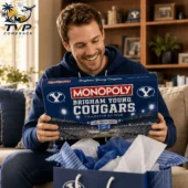 BYU Cougars Collector's Edition Monopoly Board Game 2 Man holding a BYU Cougars Monopoly board game edition.