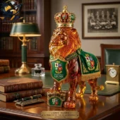 Amber glass lion figurine wearing a crown and British & Irish Lions rugby regalia