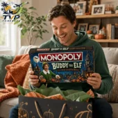 Buddy the Elf Collector's Edition Monopoly Board Game 2 Man holding a Monopoly Buddy the Elf Halloween Collector Edition board game