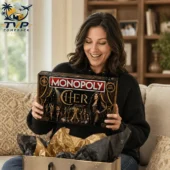 Cher Collector's Edition Monopoly Board Game 2026 2 Woman opening a Cher Monopoly Collector Edition game box from Tvpcomebackshop