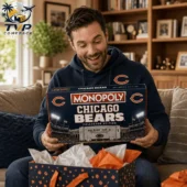 Chicago Bears Collector's Edition Monopoly Board Game 3 Man smiling while holding a Chicago Bears Collector Edition Monopoly board game from Tvpcomebackshop