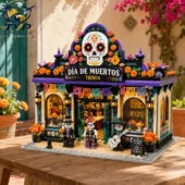 Día de Muertos Tienda brick building set on a wooden table.