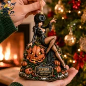 Elvira 45th Anniversary commemorative holiday ornament held in hand