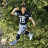 Las Vegas Raiders football player Christmas ornament hanging on a tree