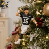 Las Vegas Raiders football player Christmas ornament hanging on a tree