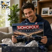 Man holding a Ford Mustang collector edition Monopoly board game from Tvpcomebackshop.