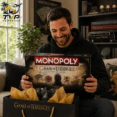 Game of Thrones Collector's Edition Monopoly Board Game 2 Man holding a Game of Thrones Collector Edition Monopoly board game from Tvpcomebackshop