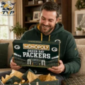 Green Bay Packers Collector's Edition Monopoly Board Game 1 Man holding a Green Bay Packers Monopoly board game.
