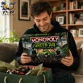 A man holding a Green Day Monopoly Collector's Edition board game