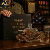 Gulf War Veteran Whiskey Limited Edition Bottle And Glass Set 3 Gulf War Veteran tank-shaped glass decanter set on a wooden table with a matching whiskey glass.