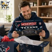 Houston Texans Collector Edition Monopoly Board Game 1 Man holding a Houston Texans Monopoly Collector Edition board game