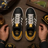 Iowa Hawkeyes Fight For Iowa Casual Air Force Shoes 2 Iowa Hawkeyes custom Adidas sneakers on a wooden table.