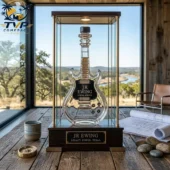 JR Ewing Special Reserve Collectible Whiskey Bottle 1 JR Ewing Special Reserve guitar-shaped bourbon whiskey bottle in a lit display case