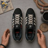 Top-down view of limited edition Adidas Jaws themed sneakers featuring maritime illustrations.