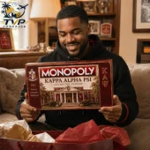 Kappa Alpha Psi 2026 Collector's Edition Monopoly Board Game 2 Man holding a Kappa Alpha Psi Monopoly Collector Edition game box.