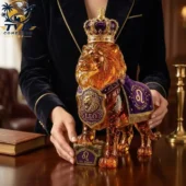 Amber glass Leo zodiac lion figurine with crown and royal purple cape by Tvpcomebackshop.