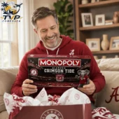 Monopoly Alabama Crimson Tide Collector's Edition Board Game 2 Man smiling while holding Alabama Crimson Tide Monopoly collector edition game