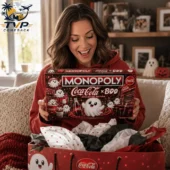 Monopoly Coca-Cola x Boo Collector Edition Board Game 2 Woman holding Monopoly Coca-Cola x BOO collector edition board game