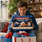 Man holding a Domino's x Boo Monopoly collector edition board game.