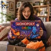 Woman happily holding a Monopoly Elemental Collector Edition game box.