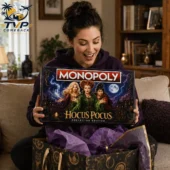 Woman holding the Hocus Pocus Collector Edition Monopoly game from Tvpcomebackshop