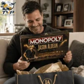 Man holding Jason Aldean Monopoly Collector Edition board game