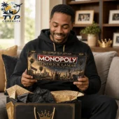 Monopoly Kendrick Lamar Collector Edition Board Game 2 A smiling man holding a Kendrick Lamar Collector Edition Monopoly game board