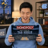 Man holding a North Carolina Tar Heels Monopoly Collector's Edition board game.