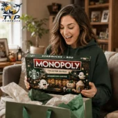 Monopoly Starbucks x Boo Halloween Collector Edition Board Game 2 Woman smiling while holding a Starbucks Monopoly collector edition game box