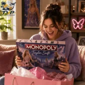 Monopoly Taylor Swift Limited Collector Edition Board Game 2026 2 A woman enthusiastically holding a Taylor Swift Monopoly collector edition board game.