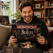 Monopoly The Beatles Abbey Road Edition Board Game 2 Man holding The Beatles Collector Edition Monopoly board game