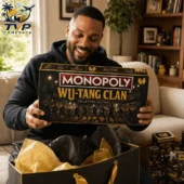 Monopoly Wu-Tang Clan Collector's Edition Board Game 3 Man holding a Monopoly Wu-Tang Clan Collector Edition board game