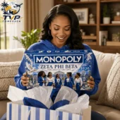 Monopoly Zeta Phi Beta Collector Edition Board Game 2 Woman smiling while holding the Zeta Phi Beta Monopoly Collector Edition game board