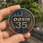 Oasis 35th anniversary commemorative metal medallion held in hand