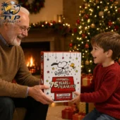 Peanuts 75th Anniversary Advent Calendar 2026 1 Grandfather and grandson holding a Peanuts 75th Anniversary advent calendar by a Christmas tree.