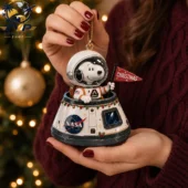 Snoopy astronaut holiday ornament in NASA capsule