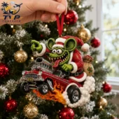 Rat Fink Santa Claus ornament driving a red hot rod car on a Christmas tree