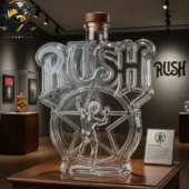 Rush Reunion Tour Commemorative Decanter Bottle 3 Crystal glass decanter shaped like the Rush 2112 logo on a display stand from Tvpcomebackshop