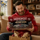 San Francisco 49ers Levi's Stadium Monopoly Board Game 2026 3 Man holding a San Francisco 49ers Monopoly Collector Edition board game.