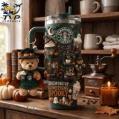 Green Starbucks Halloween tumbler with bear keychain and themed decorations