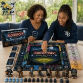 Two people playing Tampa Bay Rays Monopoly Collector Edition at Tvpcomebackshop