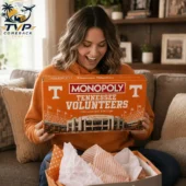 Tennessee Volunteers Collector Edition Monopoly Board Game 2 Woman smiling while holding Tennessee Volunteers Monopoly Collector Edition board game