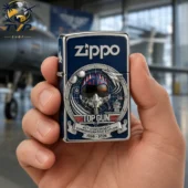 A Zippo Top Gun 40th Anniversary edition lighter held in a hand