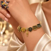 Alpha Kappa Alpha themed gold charm bracelet on a woman's wrist