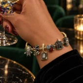 Beetlejuice themed charm bracelet worn on a wrist